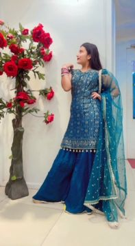 OFF-SHOULDER FERN GREEN GEORGETTE SHARARA SUIT WITH SEQUIN WORKED AND NET DUPATTA
