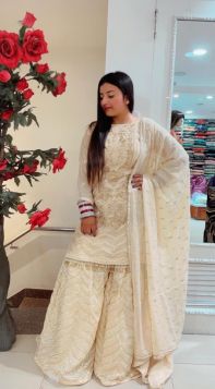 LIGHT GOLDEN SHARARA SUIT IN GEORGETTE MATERIAL WITH HEAVY EMBROIDERY